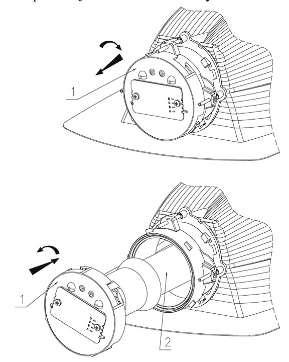 Rys. 1. Specjalny mechanizm umożliwia pozycjonowanie lampy w odbłyśniku i szczelnie zamyka komorę źródła światła 1 – pokrywa pozycjonera z oprawką 2 – źródło światła